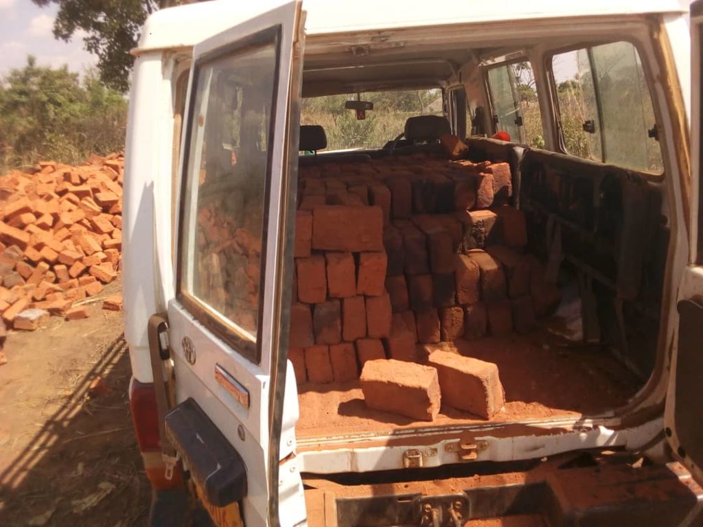 Omoro Driver In Trouble Over Using Ambulance To Carry Bricks